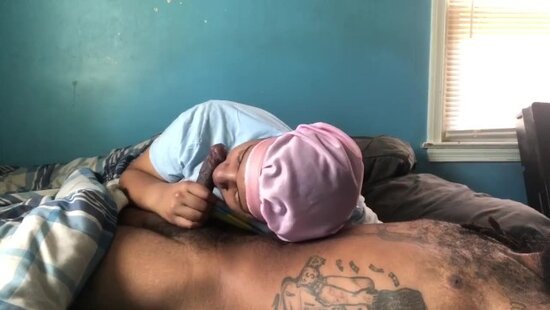 A guy covered in tattoos wakes up to his sister actively caressing and sucking his hot cock.