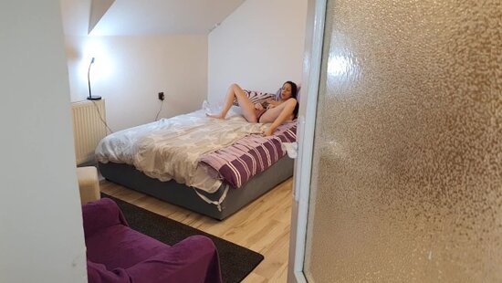 A guy caught his young stepmother masturbating and decided to help her by fucking her doggy style in her shaved pussy.